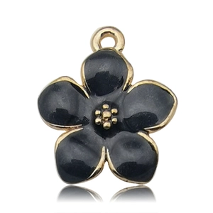 Detailed view of a black enamel cherry blossom pendant with gold-plated metallic edges