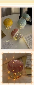 Detailed view of colorful mushroom ceramic night lights with soft light through hollow dots