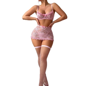 Pink lace lingerie set including underwire bra, garter skirt, and white fishnet stockings