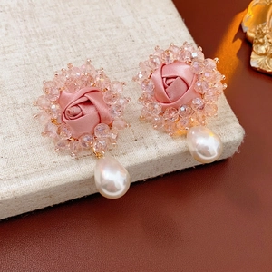 Pink fabric rose earrings with sparkling crystals and a white teardrop pearl drop