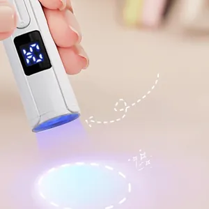 Portable handheld mini UV nail lamp with 5x convex lens and digital timer display