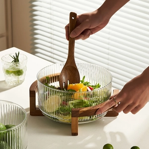 Soda-lime glass salad bowl with vertical stripes, wooden stand and matching spoon