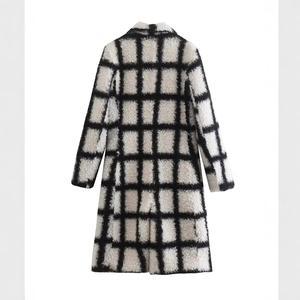 Long sleeve black and white plaid plush coat with large checkered pattern and warm fuzzy texture