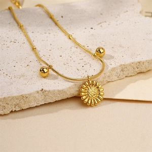 Minimalist gold sunflower necklace with metal beads on elegant snake chain