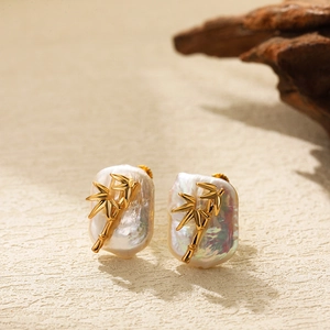 Golden bamboo leaf earrings with mother-of-pearl base in Chinese baroque style