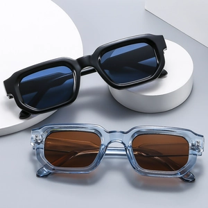 Retro rectangular chunky sunglasses in black and transparent grey on geometric props