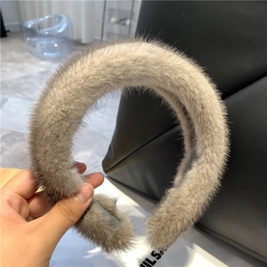 Close-up of soft brown faux mink fur headband showing thick texture and plush material