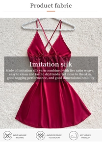 Detail of red imitation silk slip dress with premium satin weave on white plush surface