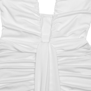 Detail of the white dress featuring elegant ruching and a knotted cross design at the waist