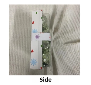 Side view of 28pcs silver-green Christmas ball ornament set in transparent box