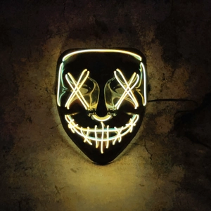 Detailed close-up of LED glowing mask with warm yellow neon wires on a textured dark background