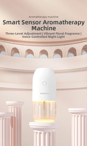 Smart fragrance diffuser with night light and mist modes on a pink architectural stage