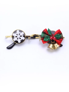 Close-up of golden metal round frames with festive snowflake and berry decorations
