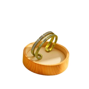 Adjustable golden titanium steel cuff bracelet with shell inlay and GIGI engraving detail