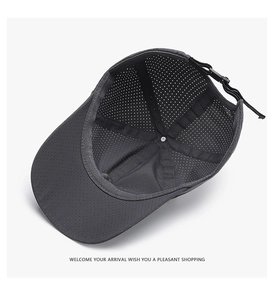Detail view of breathable black mesh fabric and adjustable buckle on the sun hat