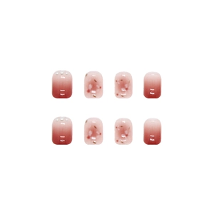 Pink gradient press-on nails with pearl accents and floral patterns in a short square shape