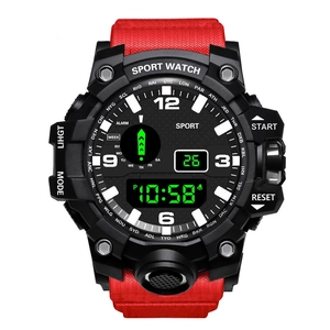 Detail view of sports watch dial with dual display, red fabric strap, and city bezel