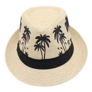 Detailed macro view of woven straw sun hat featuring a black tropical palm tree pattern