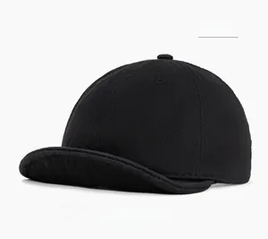 Detailed shot of black short brim cotton cap with stitched eyelets and top button