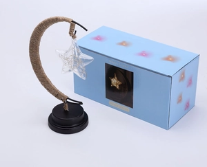 Detail of LED moon lamp with hemp rope wrapping and starry decorative gift box packaging