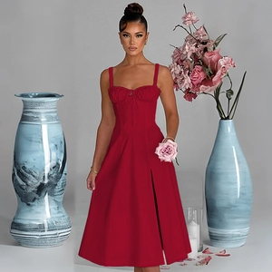 Detail view of a slim fit red strap dress with high slit and waist tie design
