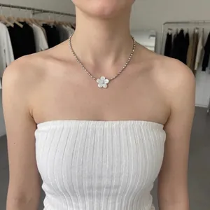 Elegant flower pendant necklace with diamond center on silver bead chain for women