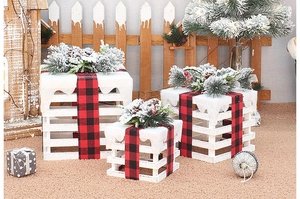 Three-piece white wooden Christmas gift box set with festive red plaid bows and pine cones