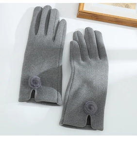 Detailed view of gray thermal gloves featuring soft fleece texture and cute pom-poms