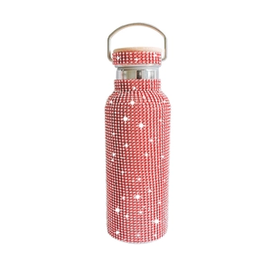 Detail of red rhinestone water bottle with metallic lid and wooden top finish