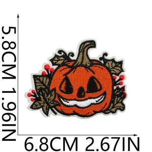 Detailed embroidery texture of orange Halloween pumpkin patch with size measurements