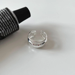 Minimalist 925 sterling silver ring with irregular texture and high-polished mirror finish