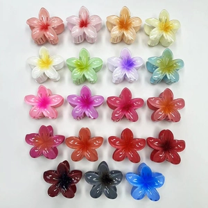 Set of 19 vibrant gradient candy-colored frangipani flower hair claws for summer styling