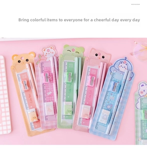 Flat lay of cute cartoon animal stationery set including ruler, pencil, eraser and sharpener
