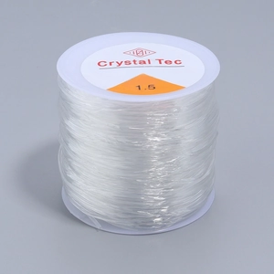 Macro view of 1.5mm Crystal Tec clear elastic string roll for DIY jewelry making