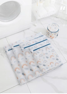 Detailed set of mesh laundry bags with colorful prints and blue zippers for protection