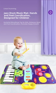 Detail of baby musical mat featuring colorful piano keys, drum pads and yellow drumsticks