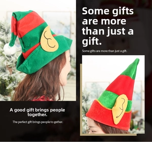Detail of red and green striped Christmas elf hats with felt ears and fluffy pom-poms