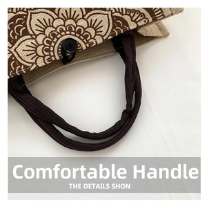 Detail of linen tote bag with brown mandala print and dark woven handle close-up