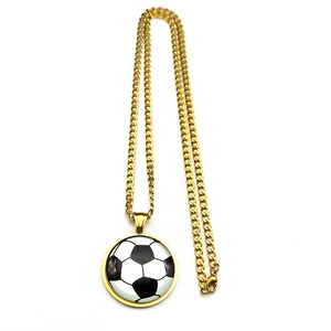 Detailed close-up of a gold chain necklace featuring a classic football charm pendant
