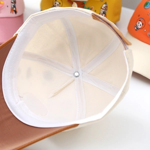 Detailed interior of kids dinosaur baseball cap featuring sweatband and reinforced stitching