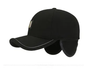 Side view of men's winter baseball cap with ear flaps and metal decorative plate