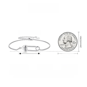 Size comparison of S925 silver heart safety pin bracelet next to a US quarter coin