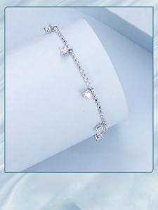 Detailed shot of sparkling zircon beads on a minimalist S925 sterling silver bracelet