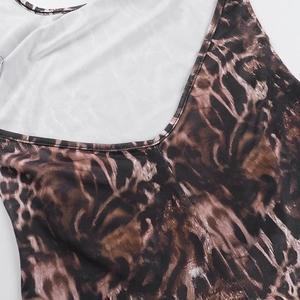 Detail of leopard print stitching and textured fabric on V-neck halter jumpsuit