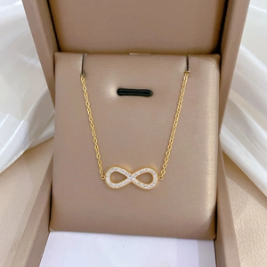 Gold titanium steel bow-shaped infinity pendant necklace with sparkling rhinestones