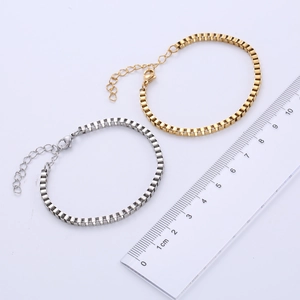Detailed close-up of 3mm stainless steel box chain bracelets in gold and silver colors