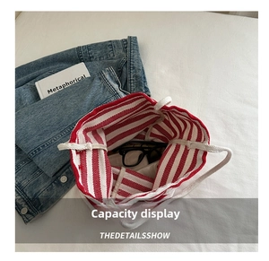 Interior view of red striped canvas tote bag showing large capacity for personal items