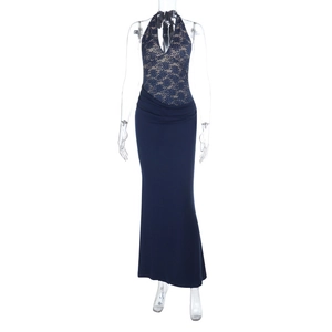 Detailed close-up of dark blue halter lace stitching on evening gown bodice