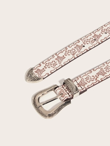 Close-up of white leather belt with brown butterfly prints and floral silver buckle