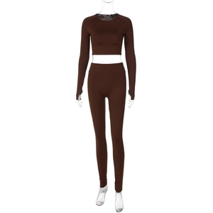 Detailed view of dark brown two-piece high-waist yoga set with long sleeve crop top
